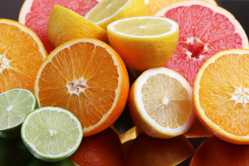 Mix of citrus fruits cut in different forms	