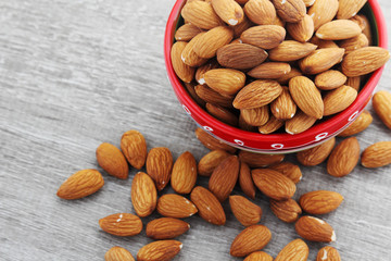 A bowl with almond at white background