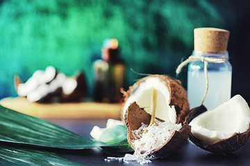 Coconut on a dark stone table. Coconut oil.