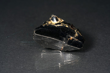 Shungit is a black rock that consists mainly of carbon and was photographed in top quality and studio quality.