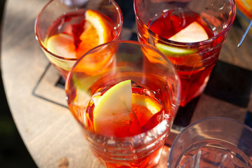 Glasses with punch. Drinks in a summer cafe. Apple slices in the drink. Drinks for guests.