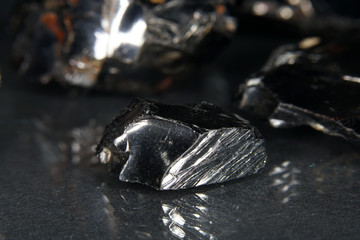 Shungit is a black rock that consists mainly of carbon and was photographed in top quality and studio quality.