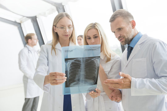 Group of doctors discuss x-ray