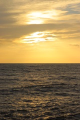 Naklejka na ściany i meble Sun set on a sea with orange sky