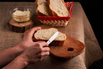 freshly baked bread on dark wooden kitchen table. Selective focus