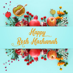 religion image of Rosh hashanah (jewish New Year holiday) concept. Traditional symbols over wooden mint blue pastel background