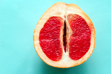 top view ripe juicy grapefruit  isolated on a blue background