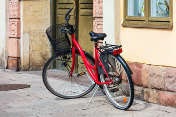 Fototapeta na wymiar red bike on city street