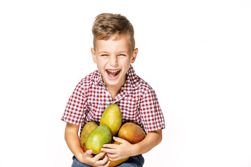 Fototapeta premium handsome boy in a red shirt with a mango