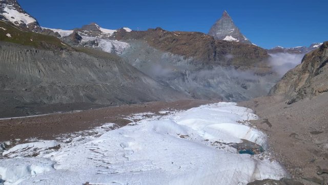 Aerial shot flying down the Gornergletscher glacier with the Matterhorn in background. Zermatt area, Switzerland