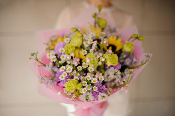 Close-up of bouquet with daisies and lilac
