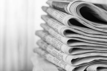 Newspapers folded stack, the concept of world news