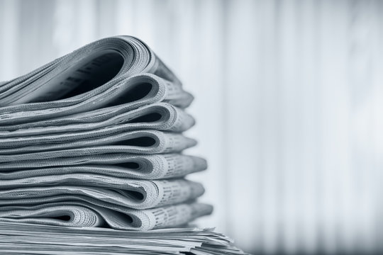 Newspapers folded stack, the concept of world news