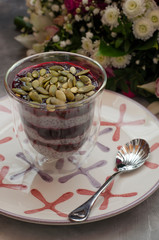 Chia Pudding on Milk with Black Currant and Bouquet