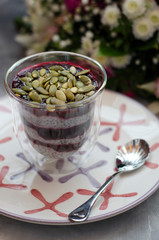 Chia Pudding on Milk with Black Currant and Bouquet
