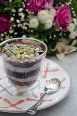 Chia Pudding on Milk with Black Currant and Bouquet