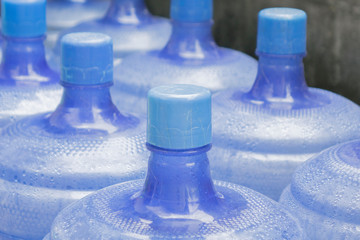 Big blue bottles of drinking water.