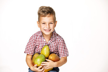 Fototapeta premium handsome boy in a red shirt with a mango