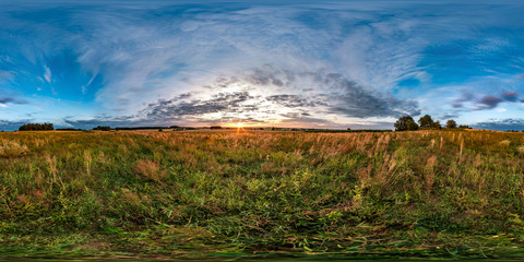 full seamless spherical hdri panorama 360 degrees angle view among fields in summer evening sunset with beautiful clouds in equirectangular projection. ready for VR AR content