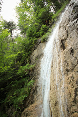 Fototapeta na wymiar Beautiful waterfalls on the tourist trail in Slovak Paradise National Park, Slovaki