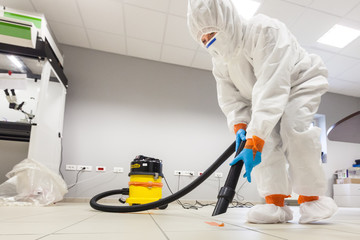 Decontamination of a room after an incident. Practical exercises during a training session on asbestos risk prevention, sample preparation room of an asbestos laboratory