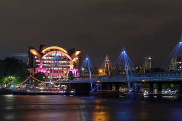 Night photo of the Hungerford and Jubilee bridges in London