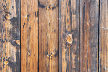 Old painted cracked  brown boards, top view. Wood texture.