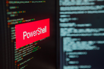 Programming language, PowerShell inscription on the background of computer code.