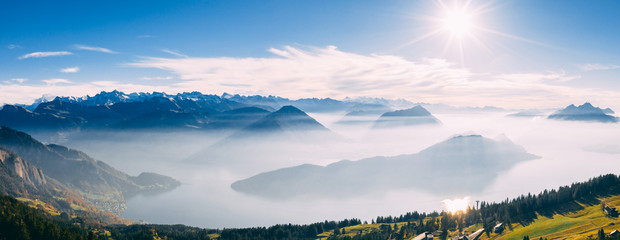 drone view over snow covered mountains during autumn, aerial view over swiss alps with lake in fog covered, rigi switzerland