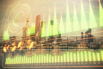 Business theme hologram with city view from roof top background. Double exposure.