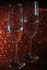 Couple Champagne Flute on red fashion background
