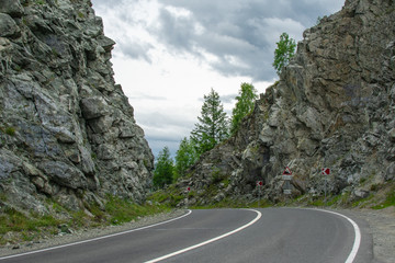 the road between the rocks leading to the mountains