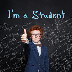 Happy student in school uniform showing thumb up and smiling. Back to school