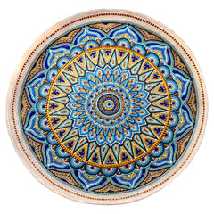 Decorative ceramic dish painted with a circular pattern, isolated on a white background.