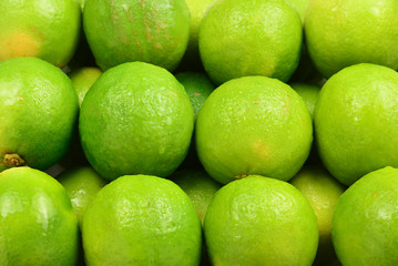 Many fresh limes on white background.
