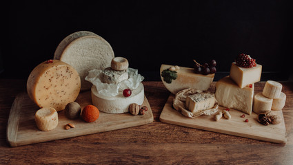various types of cheese on rustic wooden table