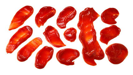 Red sauce splashes isolated on white background. Ketchup.
