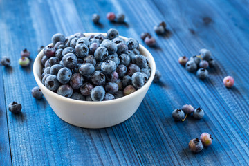 fresh blueberry on blue wooden background