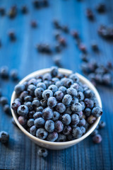 fresh blueberry on blue wooden background
