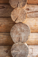 wooden background made of logs, located in the middle