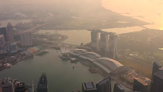 Drone Aerial view 4k Footage of the Marina Bay Sands in Singapore City Skyline. Sunrise