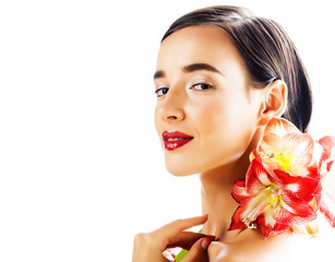 Fototapeta na wymiar young pretty brunette real woman with red flower amaryllis close up isolated on white background. Fancy fashion makeup, bright lipstick, creative Ombre manicured nails