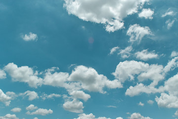 blue sky background with tiny clouds.