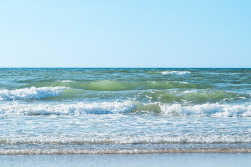 pure azure clear water with white foam on the sea on a sunny aft