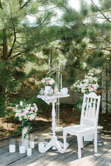 Still life brides morning, dish with cup of tea, champagne glass, wedding rings and flower bouquet