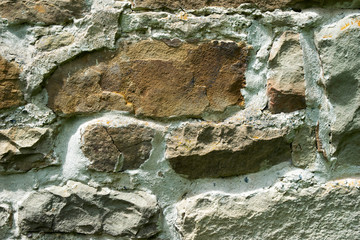 texture of masonry, a fragment of a stone wall of an ancient temple of the 10th century, background, backdrop