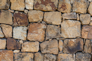 Stone block built wall