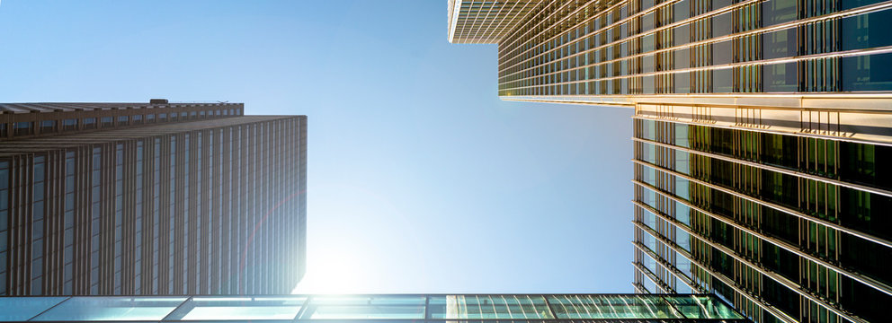 Modern city building architecture with glass fronts on a clear day in London, England panoramic