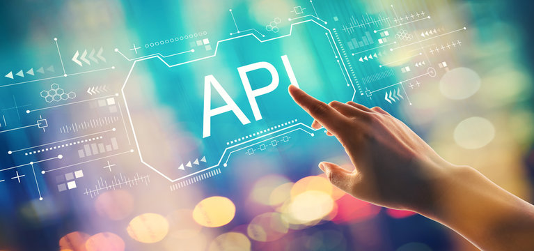 API concept with hand pressing a button on a technology screen