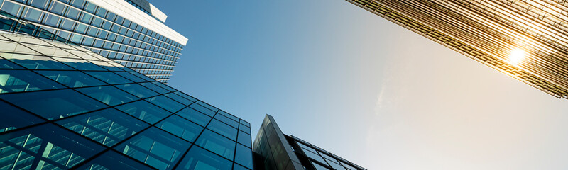Modern city building architecture with glass fronts on a clear day in London, England panoramic - obrazy, fototapety, plakaty